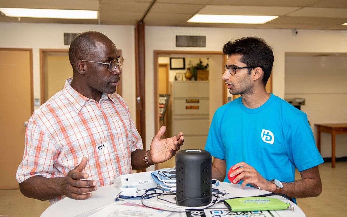 Two men talking at the event