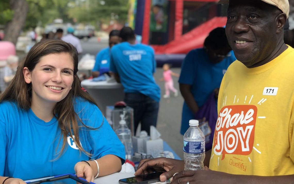 Two people smiling at the event