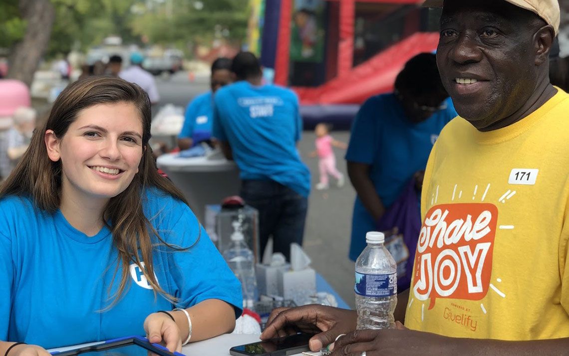 Two people smiling at the event