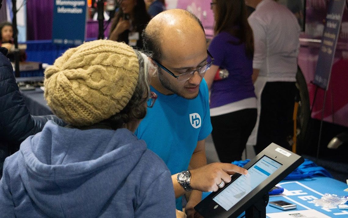 Volunteer explaining data to a participant 